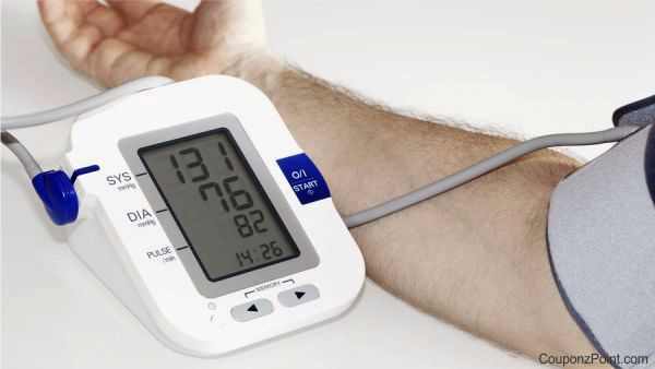 Man measuring high blood pressure at home